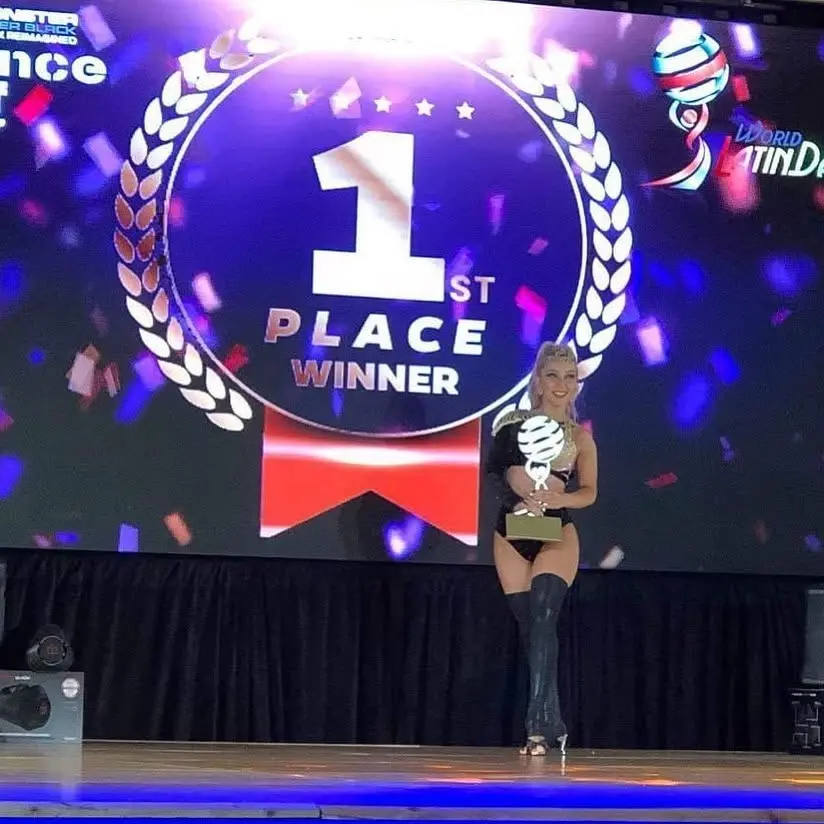 Kristi Hall receiving a first-place world Latin dance title