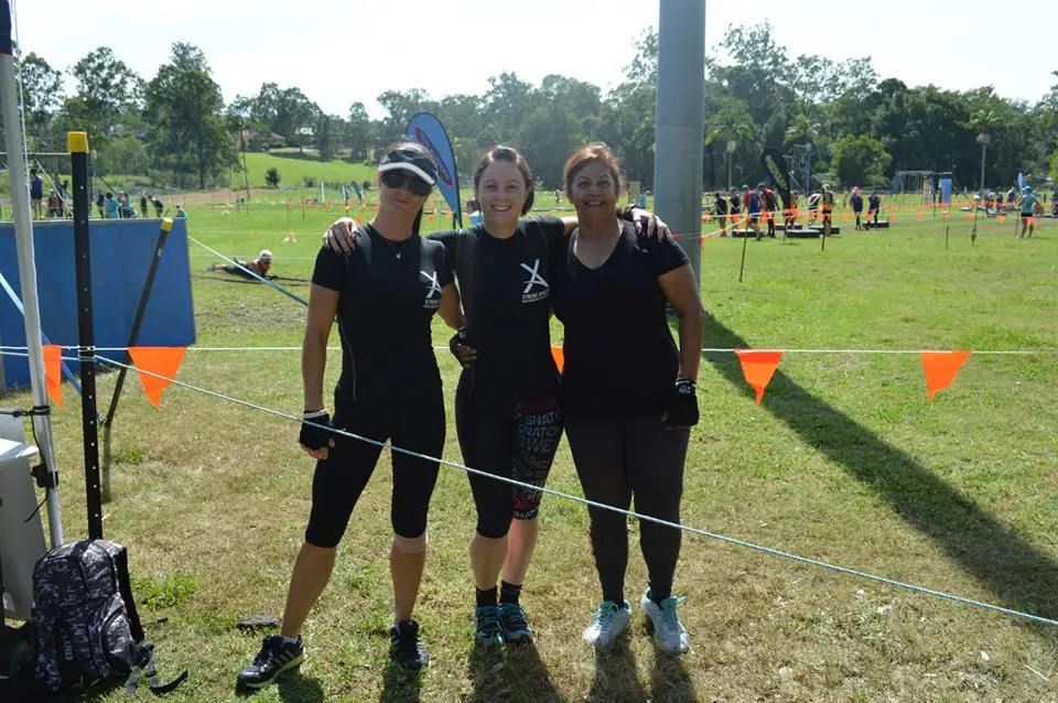 Three Xtreme Athlete clients together at an outdoor fitness event