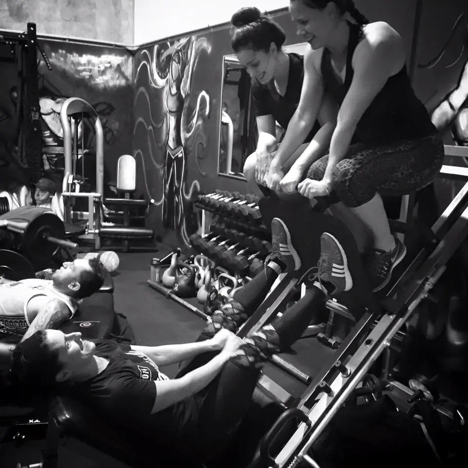 Xtreme Athlete clients working together during a coached strength session
